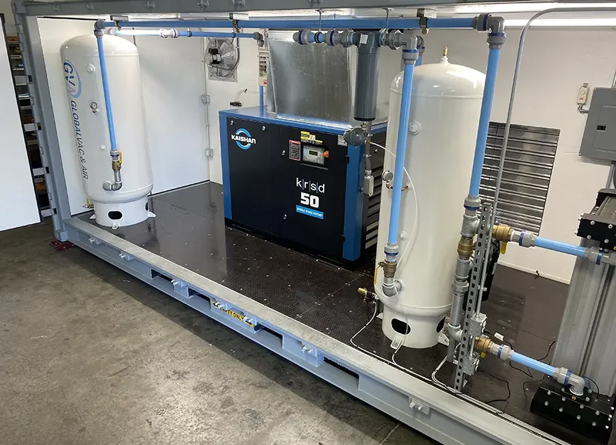 Inside of containerized equipment room showing a complete compressed air system