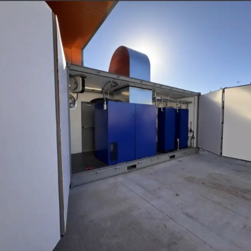 Mobile Engineered Solution enclosure for university research lab. outside of unit with open doors to Quincy air compressors.