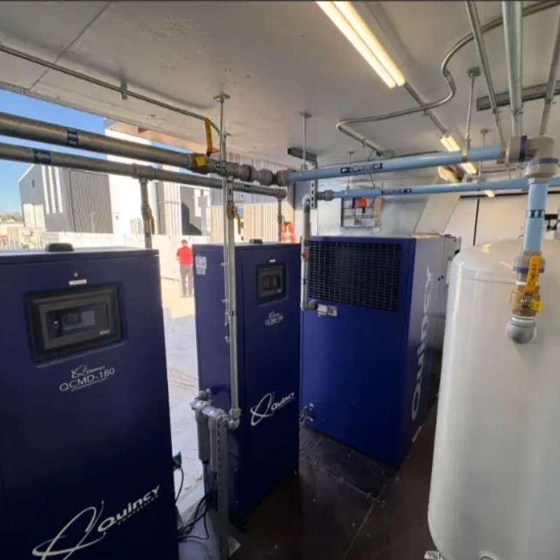 inside of Mobile Engineered Solution enclosure with a Quincy oil free air compressor and 2 desiccant air dryers