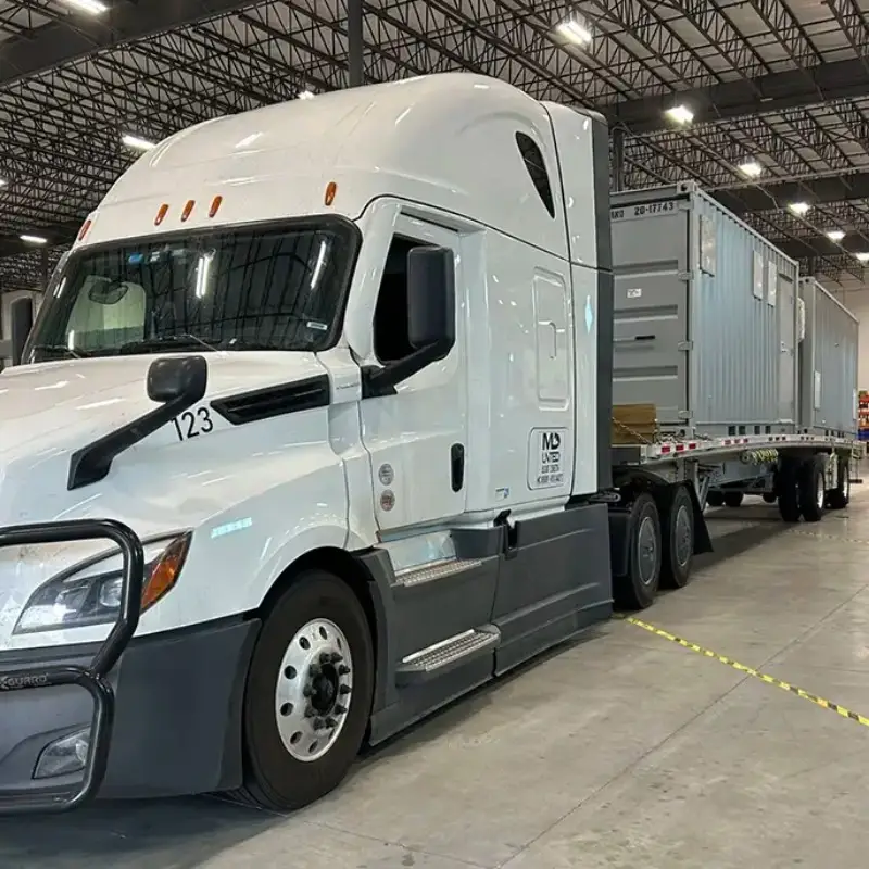 Equipment enclosure mounted on semi truck for dairy biogas cleanup site.